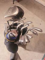 Top view of bag with driver, irons and wedges visible