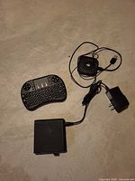 Lot overview: T95X box, mini keyboard, Qi charger, power adapter, USB lead