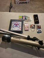 Overview showing telescope, tripod and all accessory items on table