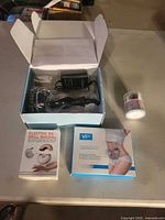 All items: radio sculpting machine in open box with adapter, electric nail drill manual, Belly Firming cream jar, VEase Very product box