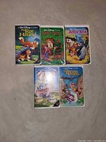 Front view of five Disney Classics VHS tapes laid out showing cover art