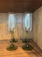 Four green-stem champagne flutes