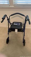 Front view of Drive Medical rollator showing seat, frame and wheels