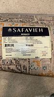 manufacturer label identifying Safavieh Monaco design, size and material