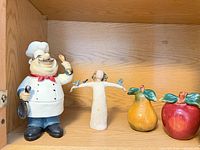 All four figurines on shelf