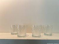 Front view of all four hobnail tumblers