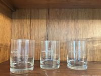 Three tumblers front view showing etched logo and condition