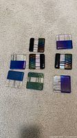 All eight square fused glass coasters laid out