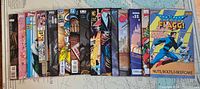 All 17 comics laid out side-by-side showing spines and covers