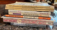 Stacked view showing spines of all magazines and books