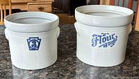 Both crocks side by side showing size difference and front graphics