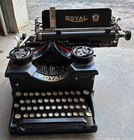 Front view of Royal Model 10 typewriter showing keyboard, ribbon spools and logo