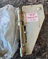 Front view of LAD-SAF LS-34 rope grab showing label and hinge mechanism
