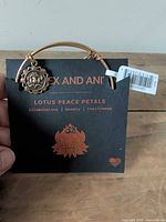 Front view of bangle on Alex and Ani Lotus Peace Petals card with tag visible