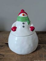 Front view of ceramic snowman cookie jar showing painted details