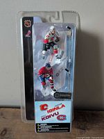 Front view of sealed two-pack showing Iginla and Koivu figures with accessories