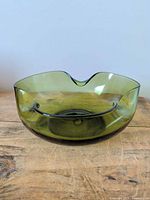 Full view of olive green glass bowl showing shape and color
