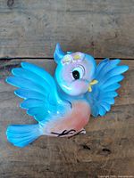 Front view of bluebird ceramic wall hanging