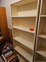 Front view showing five shelves and adjustable hole system