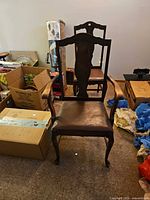 Front view of antique wood armchair