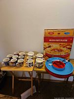 Full lot showing heated party platter box, assembled platter, Halloween mugs and soup mugs
