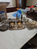Group view of all silver-plated items on table