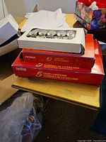 Stacked boxes of NOMA and Carillon candolier light sets