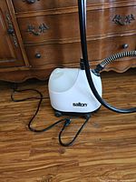 White Salton steamer base with power cord and hose
