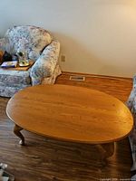 Top and legs of the oval oak coffee table