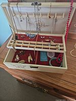Overall view of jewellery box open with contents displayed