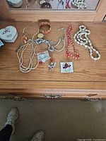 Overall view of jewellery items on dresser