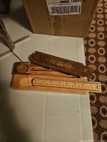 Wooden folding rule and two antique wooden pencil boxes