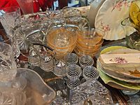 Overview showing amber bowls, egg cups, crystal trays