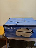 Box showing Durabrand Roaster Oven branding and product image