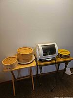 Full lot showing rotisserie, bamboo steamers, platter and plates