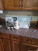 Overview showing casseroles, tea-for-one set, dessert plates, candle holders and rack