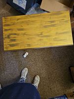 top view of rectangular distressed yellow table