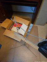 Music stand next to box of sheet music