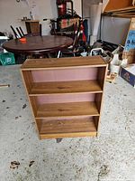 Front view showing three shelves and finish