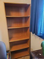 Front view of 5-shelf wood veneer bookcase