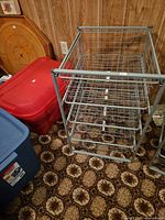 Metal frame with 4 wire mesh drawers shown assembled