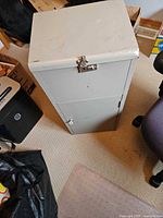 Closed cabinet showing exterior, locking hasp and knob