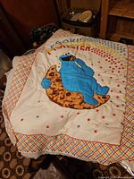 Cookie Monster printed baby quilt panel on table