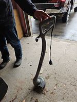 Full view of gray corded Earthwise string trimmer