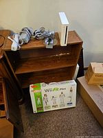 Console, balance board, cables, Wii Fit Plus retail box
