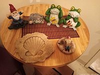 All six garden décor pieces arranged on table