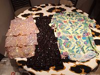 Overview of all three clothing items laid out on table