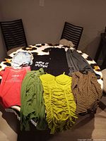 All seven garments laid on table