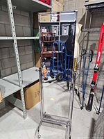 Front view of full-length chrome cheval mirror on stand