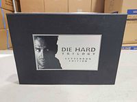 Front of black slipcase showing title panel